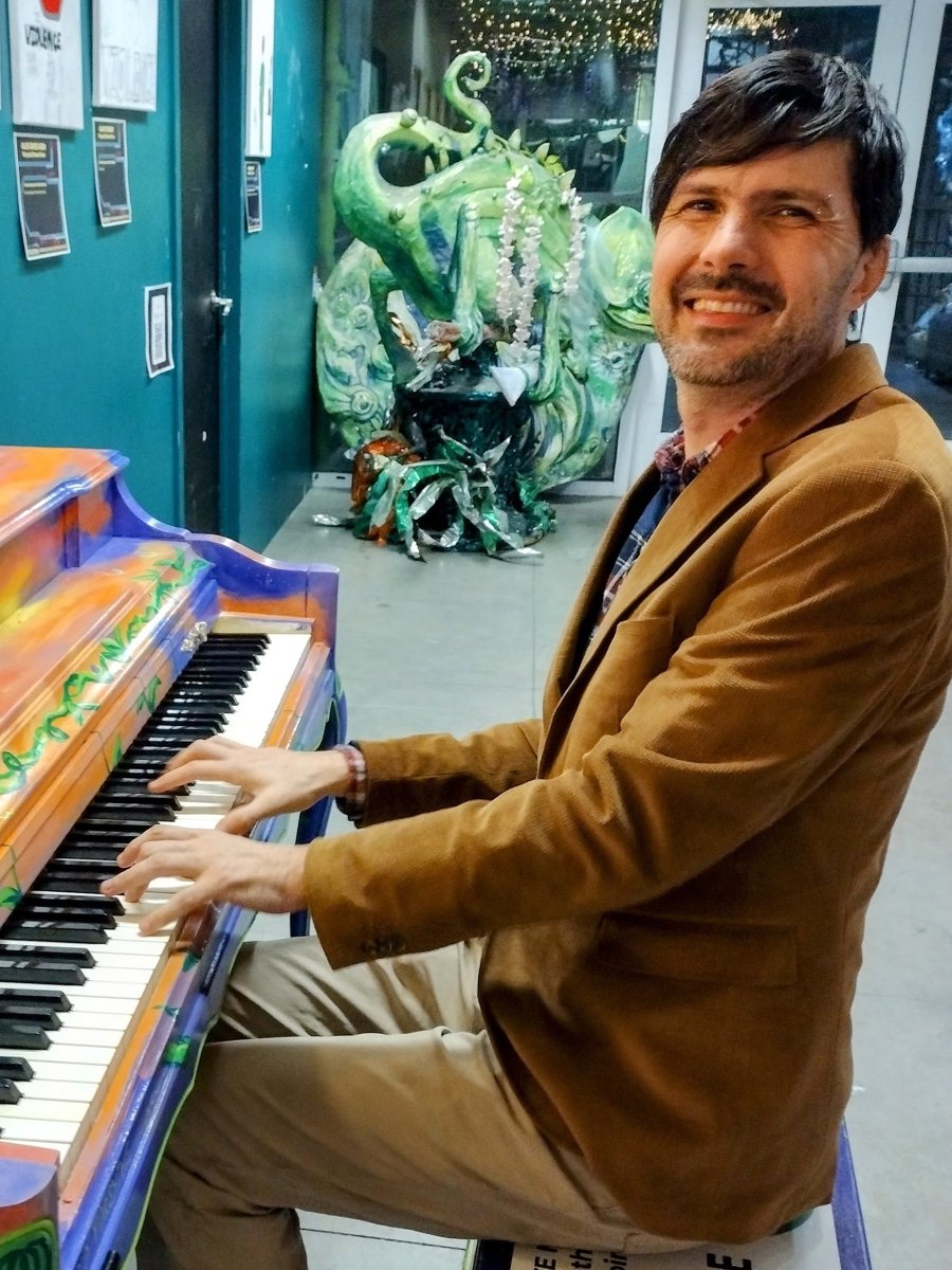 Luke Palmer plays a painted piano